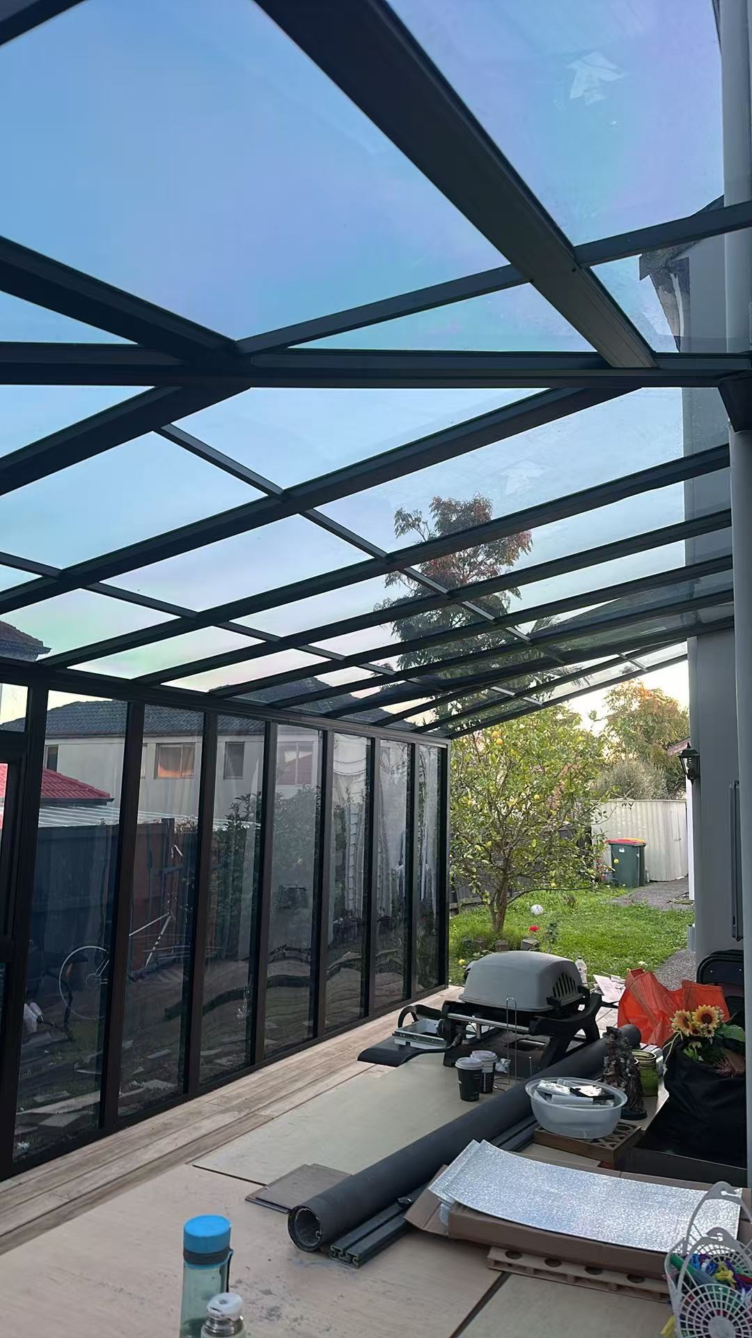 Interior of a custom aluminium sunroom with a polycarbonate roof
